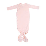 Pink baby knotted gown with buttons on a white background
