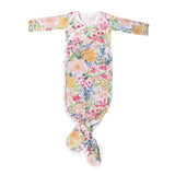 Floral-patterned baby gown on a white background
