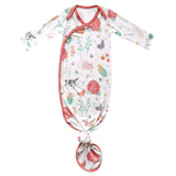 Baby knotted gown with farm animal pattern on a white background