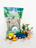Camping-themed kid's play kit with toys and accessories on a white background