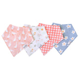 Set of four colorful bandana bibs with different patterns on a white background