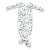 Baby gown with fish pattern on a light blue background