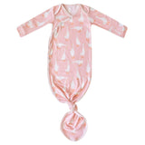 Pink baby knotted gown with goose pattern on a white background