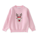 Pink sweater with reindeer design on a white background