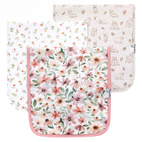 Set of three burp cloths with floral and animal prints on a white background