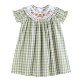 Green checkered dress with embroidered collar on a white background