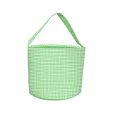 Green and white gingham bucket bag with a strap on a white background