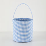 Blue and white gingham bucket bag on a light gray background
