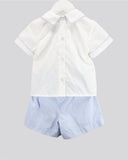 A baby boy's two-piece outfit consisting of a white short-sleeve button-up shirt with light blue piping on the collar and sleeve cuffs, buttons all the way down the back, paired with light blue and white micro-checkered shorts, shown on a hanger against a solid gray background.